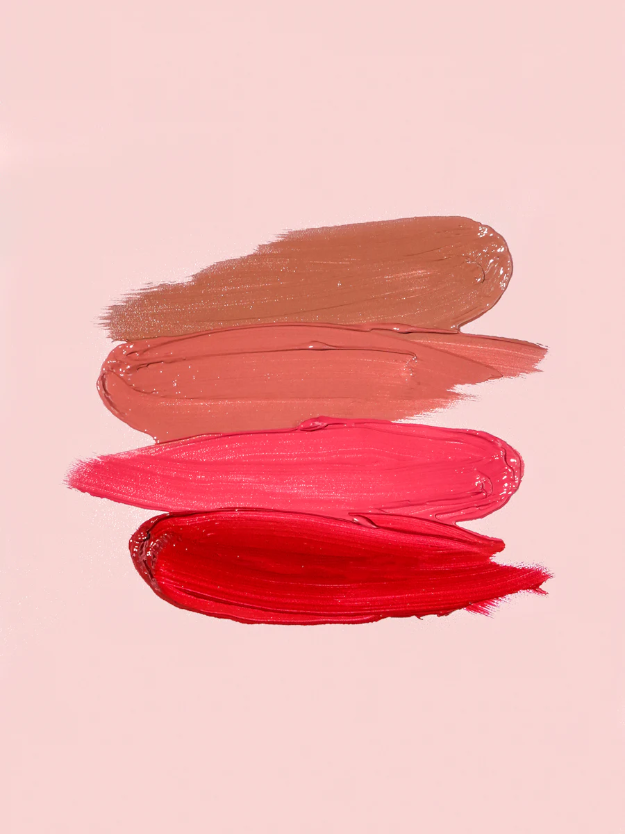 Lip colour swatches in brown, peach, pink and red