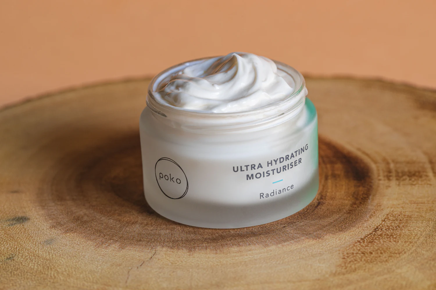 A jar of rich moisturiser on wood