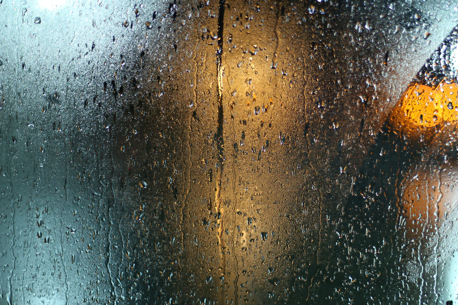 Rain on a window at night