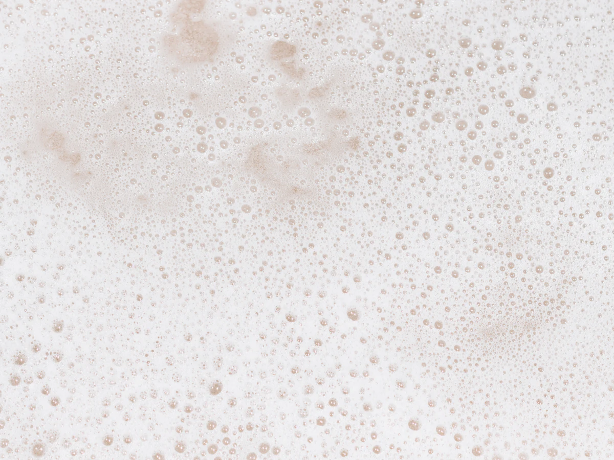 Soft white cleanser foam in close-up