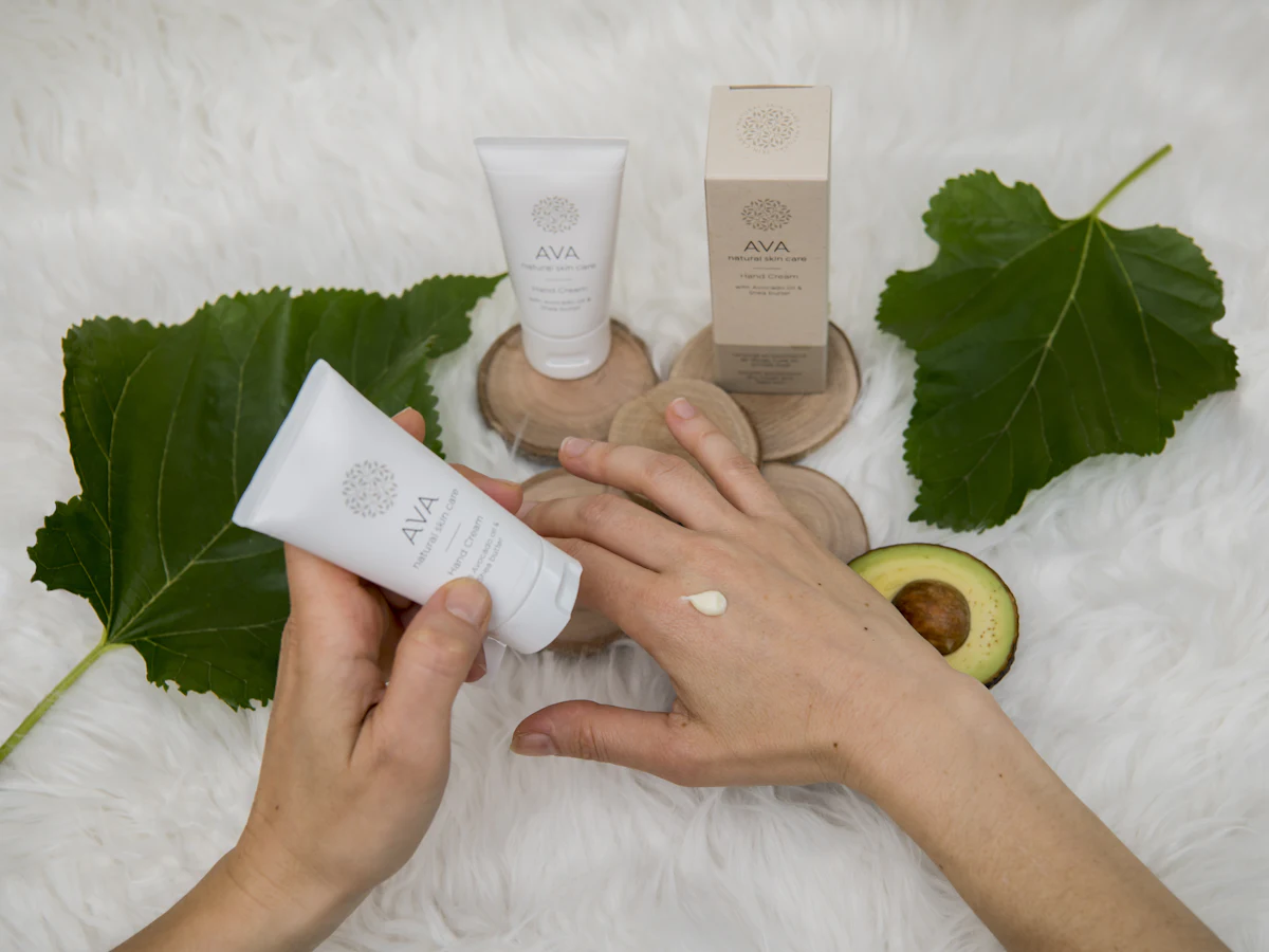 Massaging hand cream into the back of the hand