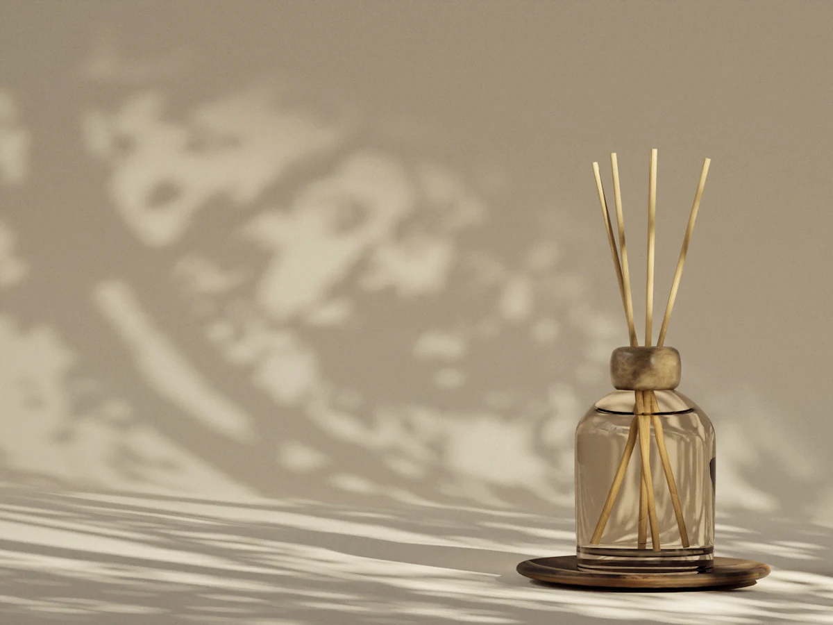 A reed diffuser casting soft shadows